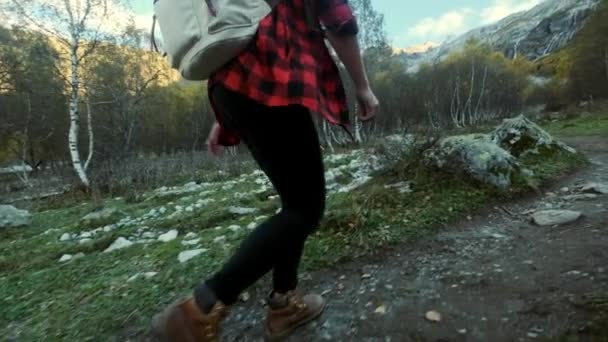 Foot steps of hiker hiking outdoors. walking feet on rocky terrain. jumping over stones. — Stock Video