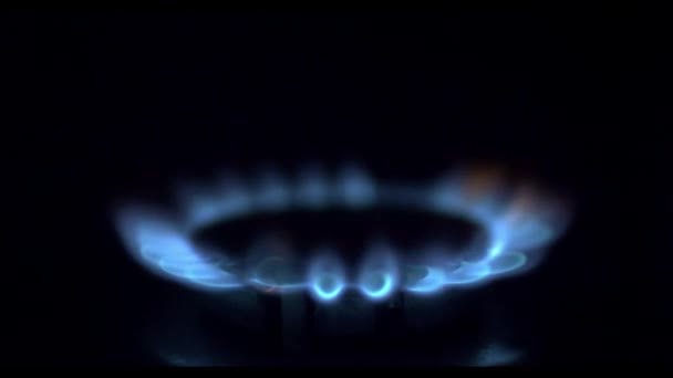 Kitchen burner turning on.Stove top burner igniting into a blue cooking flame. Natural gas inflammation, close up. — Stock Video
