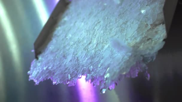 Ice making machine. Ice chunks fly out of the metal refrigerator. Industrial ice production. — Stock Video