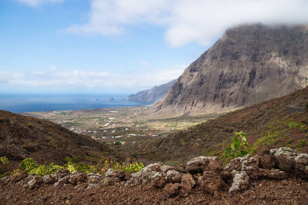 View on the cliffs and red hills of El Golfo valley until the ocean, Frontera, El Hierro, Canary Islands, Spain