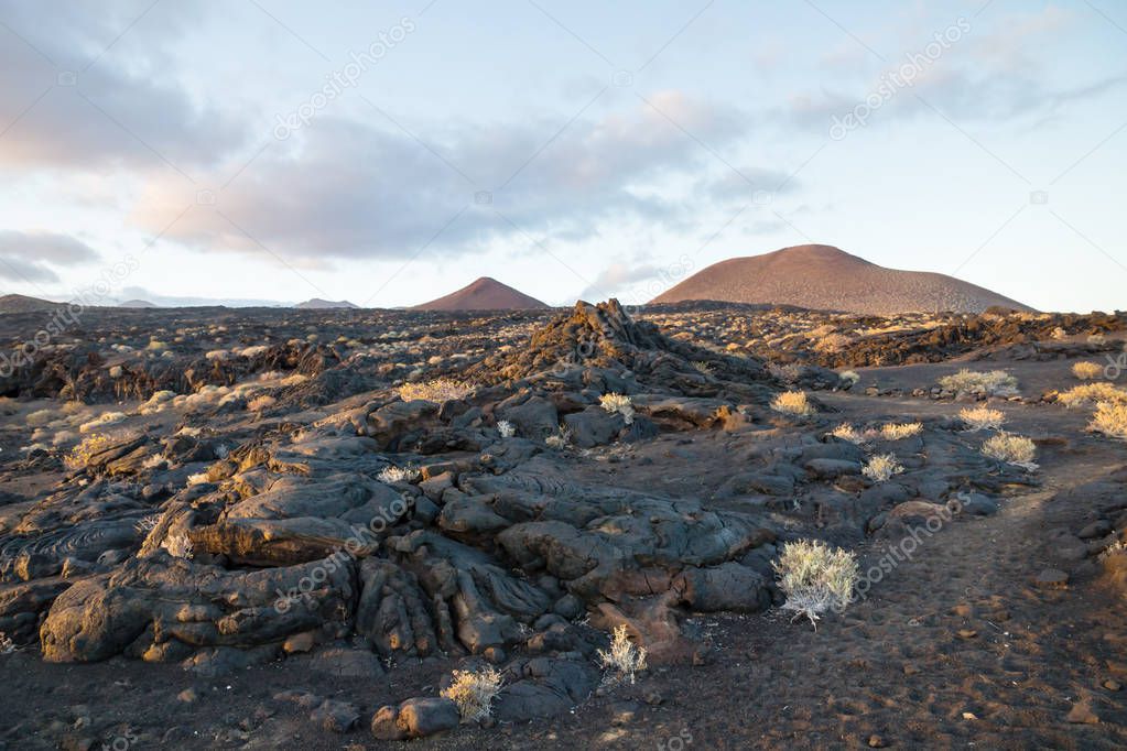 Lava fields at sunset with black rocks and lava streams, La Restinga, El Hierro, Canary Islands, Spain