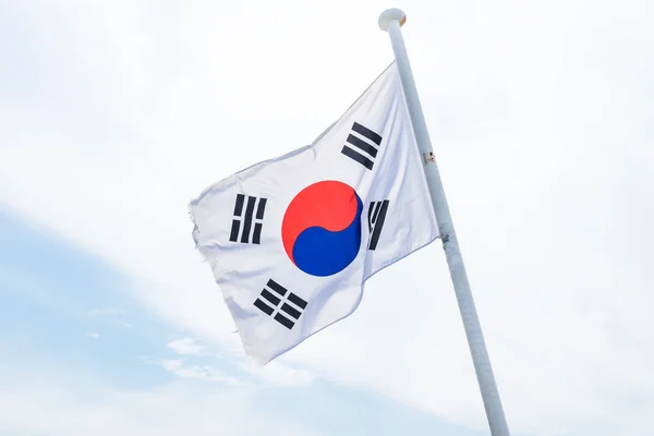 Korean flag with wind on white cloud