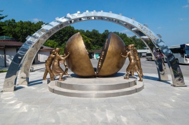 Monument at the third tunnel in the DMZ between North and South Korea as a symbol of unification and peace clipart