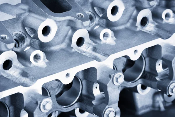 Close-up of the cylinder block in the light blue scene.Automotive part,machine part .