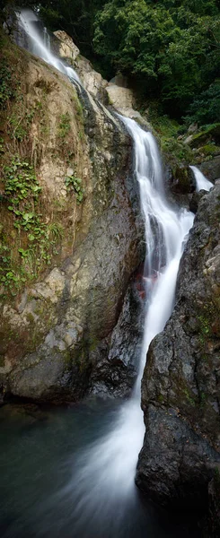 Mountain waterfall vertical panorama