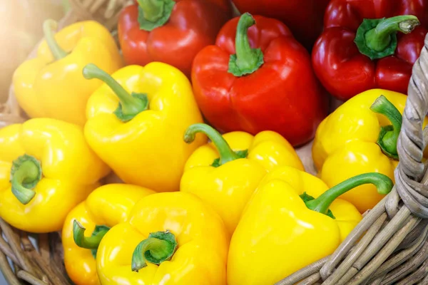 Basket with red and yellow peppers