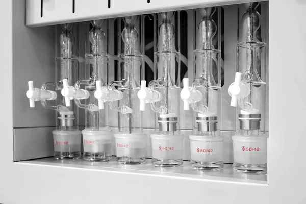 Test tubes and flasks in analytical laboratory