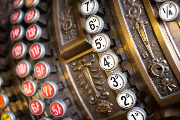 The fragment of old and vintage adding machine.