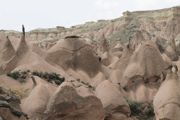 Unusual unique shapes of rocky mountains in Cappadocia, Turkey. Wonderful landscape