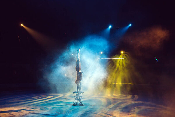 A man dancing in the circus arena.