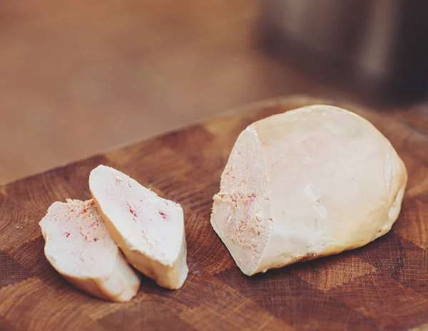 Goose liver on wooden Board in restaurant