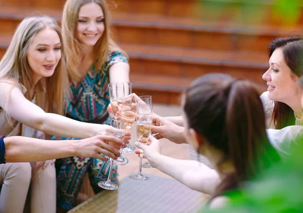 Celebration. People holding glasses of champagne making a toast