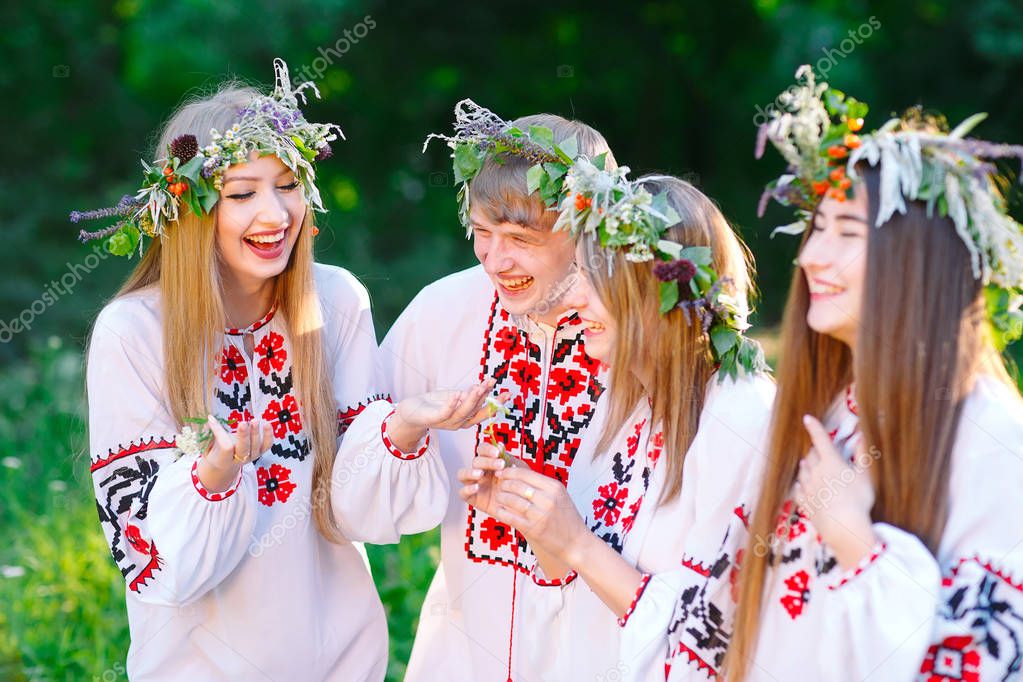 Midsummer. A group of young people of Slavic appearance at the celebration of Midsummer.