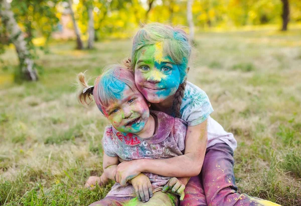 Portrait of the sisters, painted in the colors of Holi — Stock Photo, Image