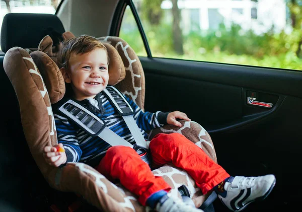 Adorable baby boy in a safety car seat. — Stock Photo, Image