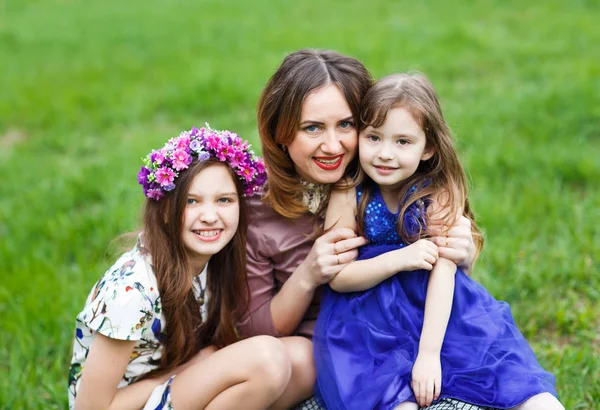 Portrait of a Young mother and her two daughters — Stock Photo, Image