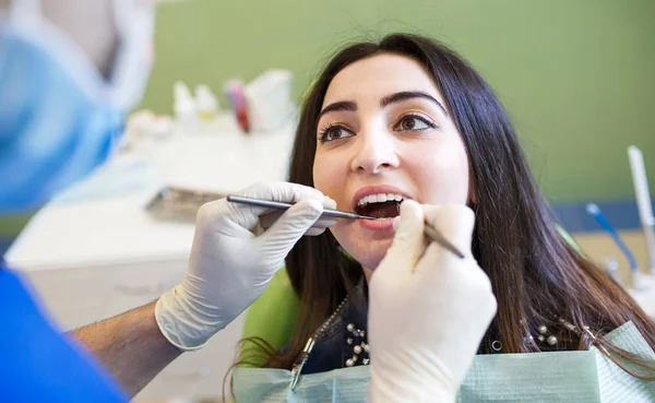 The patient at the dentist. Dental clinic. — Stock Photo, Image