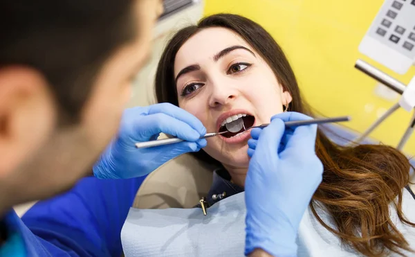 The patient at the dentist. Dental clinic. — Stock Photo, Image