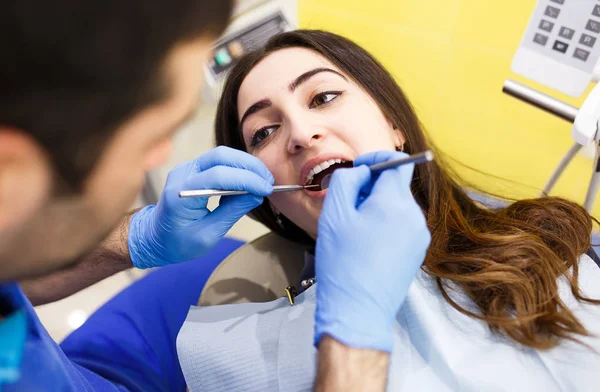 The patient at the dentist. Dental clinic. — Stock Photo, Image