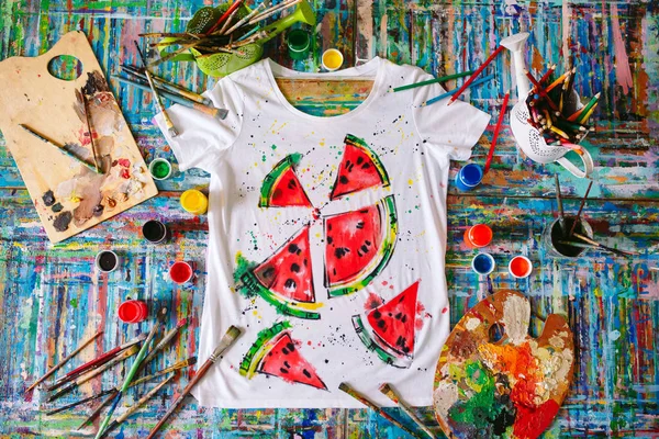 Drawing on clothes. drawing watermelon on a white t-shirt.