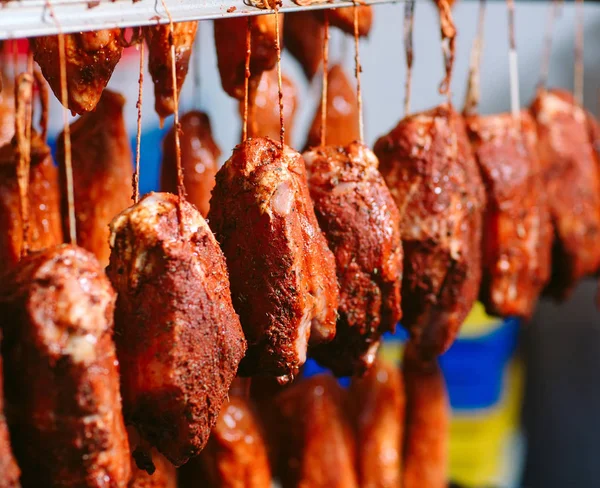 stock image Smoked ham in the oven. Sausage production in the factory