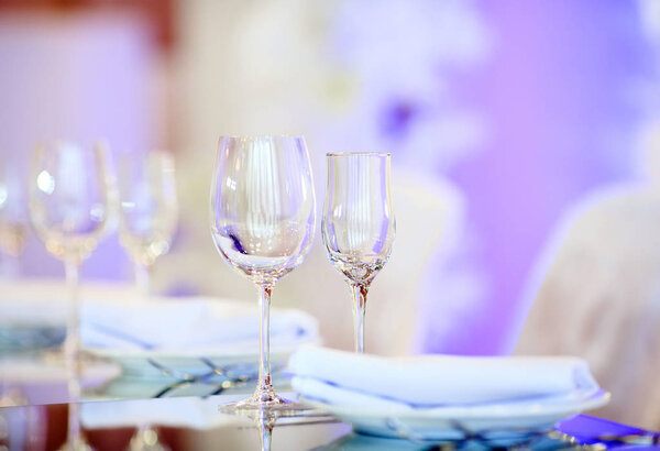 Empty glasses set in restaurant. Part of interior