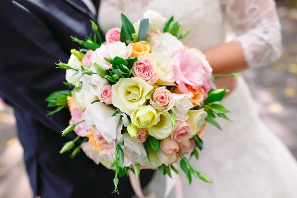 Wedding bouquet as a symbol of tenderness and beauty of the bride