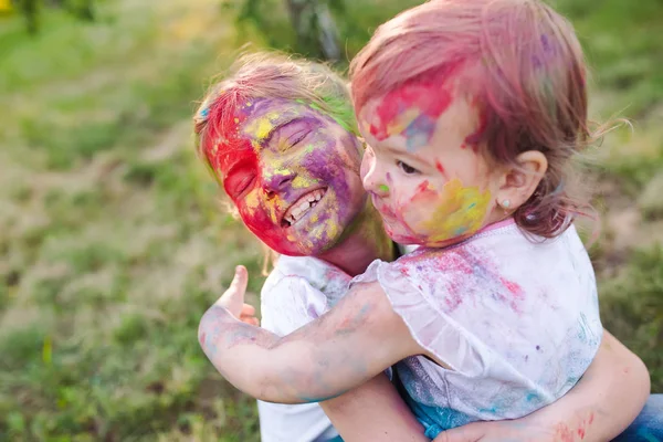 Portrait of the sisters, painted in the colors of Holi. — Stock Photo, Image