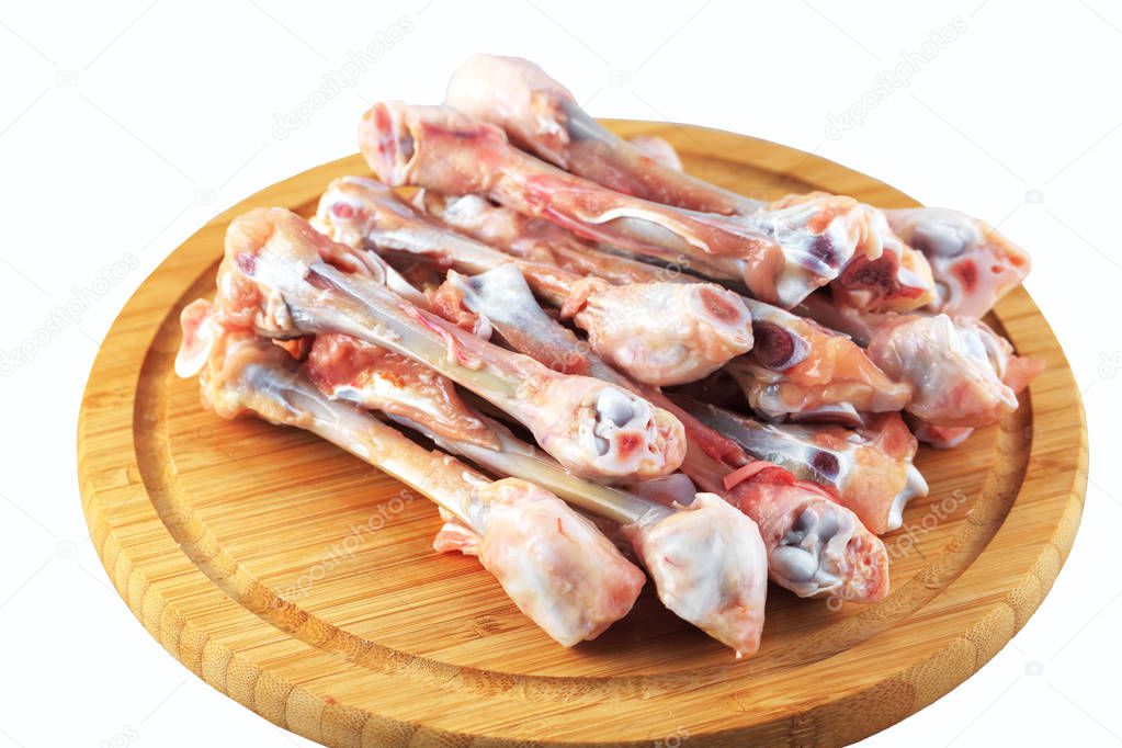 raw chicken bones on a white background