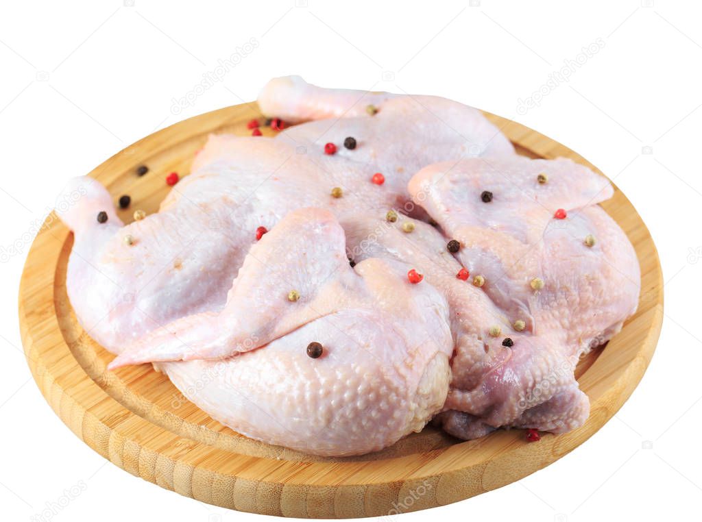 raw chicken carcass on the cutting board isolated on white background.