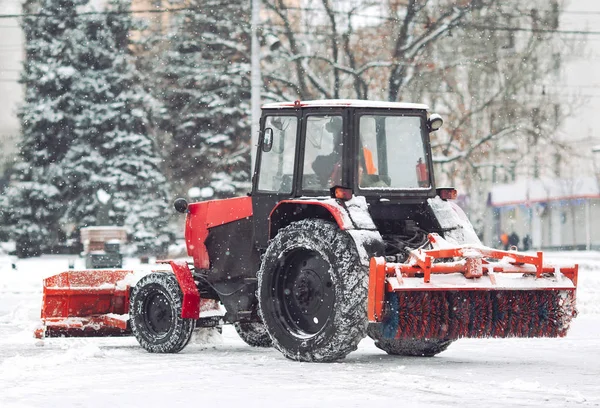 Snow machine cleans the snow in the city.