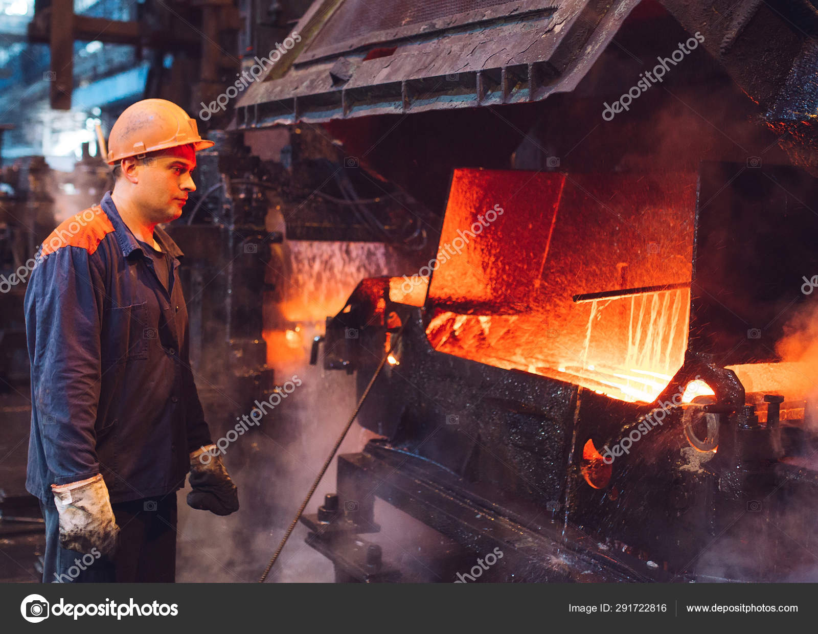 Workers in the steel mill. Metallurgical industry. Stock Photo by