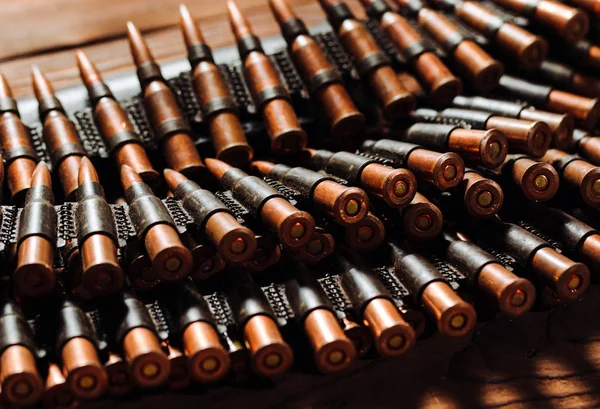 Bullets on a wooden background. Military concept. — Stock Photo, Image