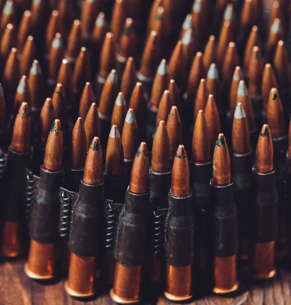 Bullets on a wooden background. Military concept. — Stock Photo, Image