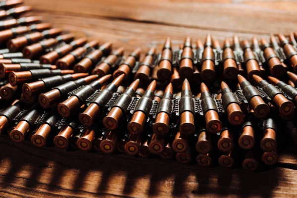 Bullets on a wooden background. Military concept. — Stock Photo, Image