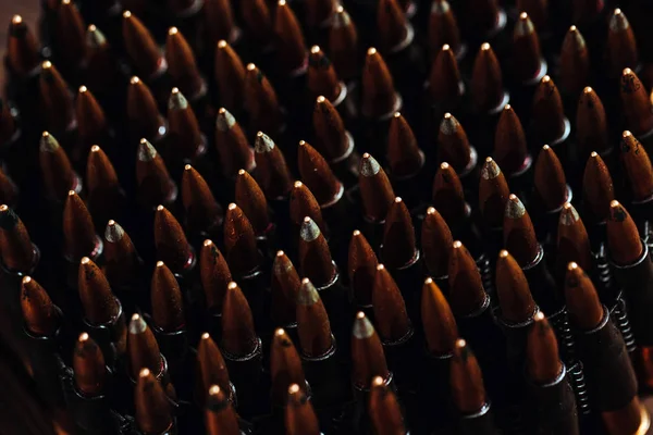 Bullets on a wooden background. Military concept. — Stock Photo, Image