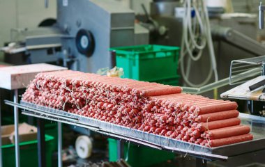 Making sausages, food production in the factory. clipart