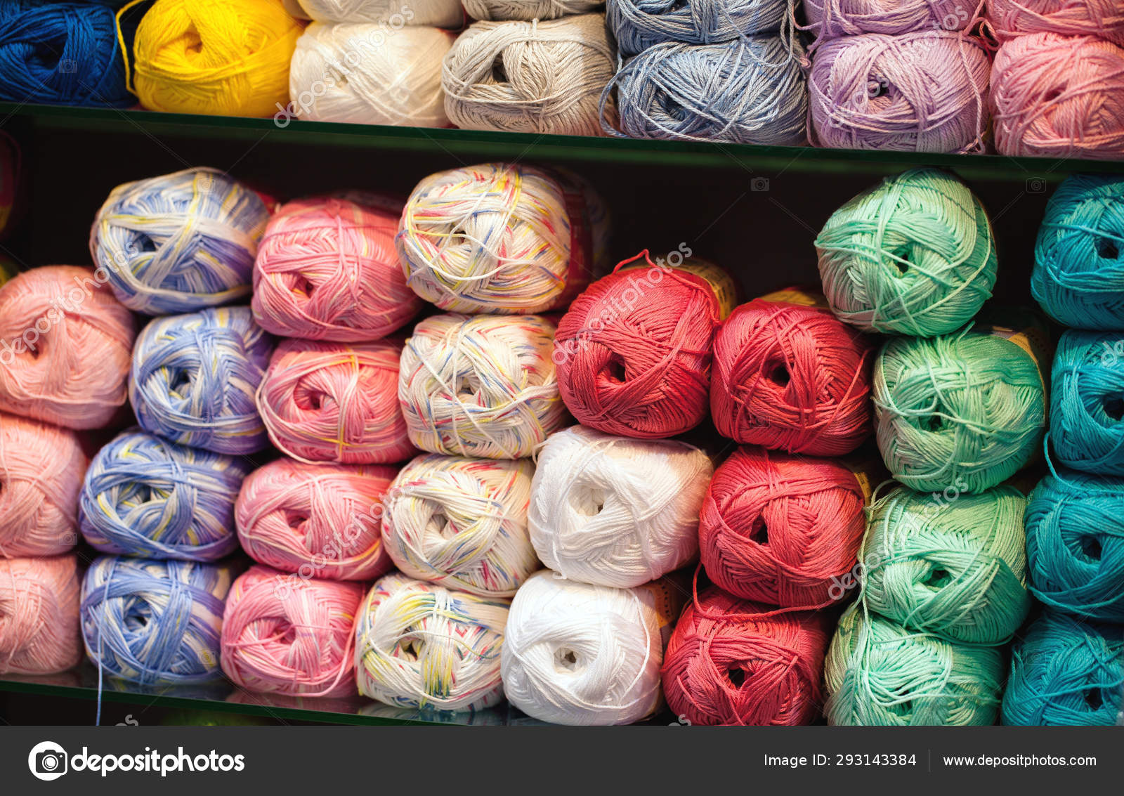 Colorful threads. Selection of colorful yarn wool on shopfront. Knitting  background, a lot of balls. Knitting yarn for handmade winter clothes.  Stock Photo by ©davit85 293143384