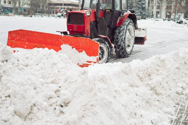 Snow machine cleans the snow in the city. Royalty Free Stock Images