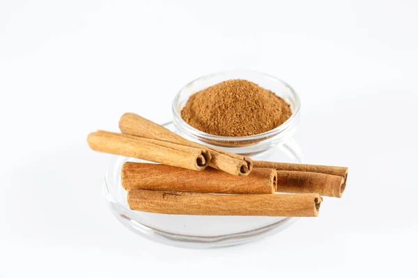 Cinnamon Isolated on the white background in a plate. — Stock Photo, Image