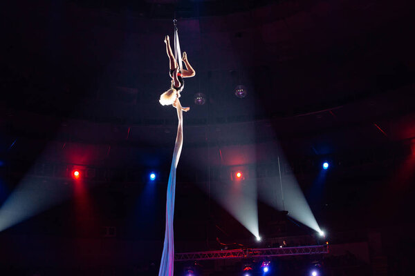 Girls aerial acrobatics in the Circus ring.