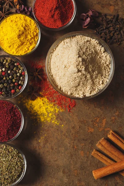 Ground Ginger . Place for text. Different types of Spices in a bowl on a stone background. The view from the top — Stock Photo, Image