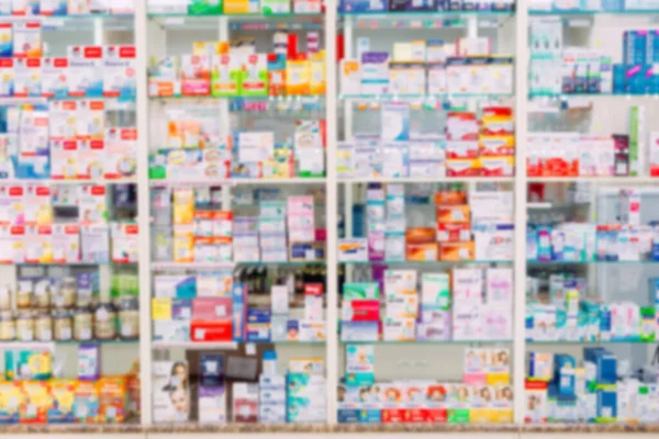 Mostrador de la tienda de farmacia fondo estante borroso enfoque borroso farmacia farmacia farmacia medicamento en blanco farmacia farmacéutica. — Foto de Stock
