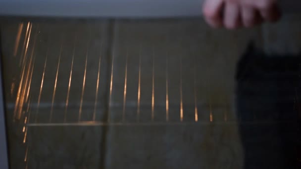 Woman put batter for cupcakes in oven in kitchen closeup. Cooking time. — Stock Video