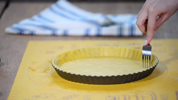 Prick the base of the pastry case all over with a fork. Making Apple Pie Tart Series. — Stock Video