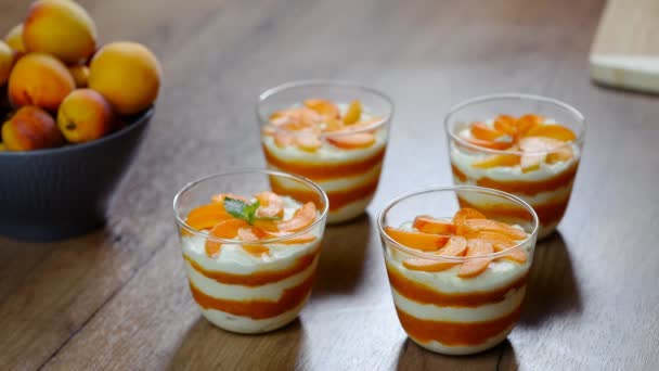Garnish the apricot mousse with mint leaves. — Stock Video