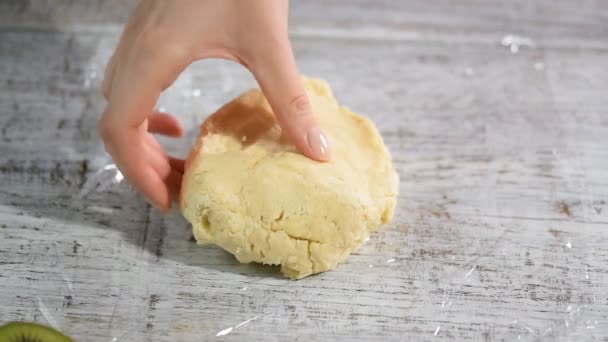 Wrap dough in clear film. Making short-cut puff pastry. — Stock Video