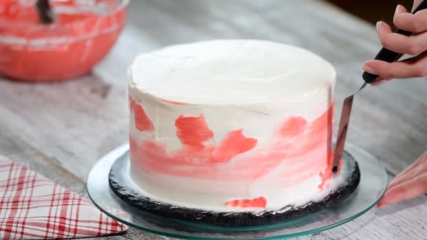 Confectioner Hand Smears Pink Creme White Icing Sponge Cream Cake — Stock Video