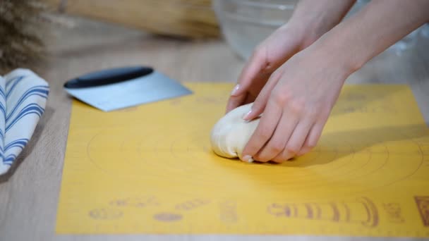 Professional baker divides the dough into portions and weights them. Process of making bread at bakery commercial kitchen. — Stock Video