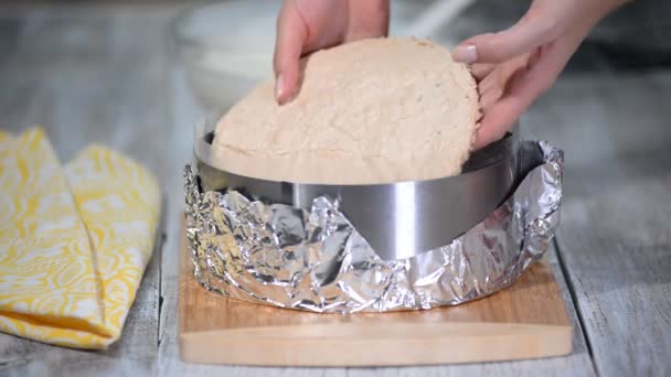 Mousse yogurt cake. Girl making mousse cake on the kitchen. — Stock Video